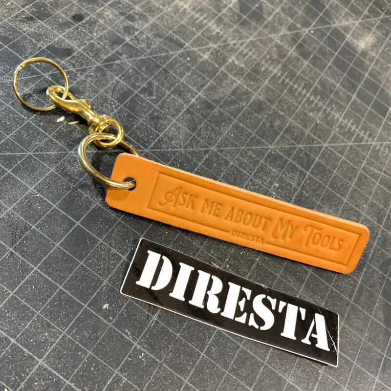DIRESTA “ASK ME ABOUT MY TOOLS” LEATHER KEY CHAIN WITH STICKER